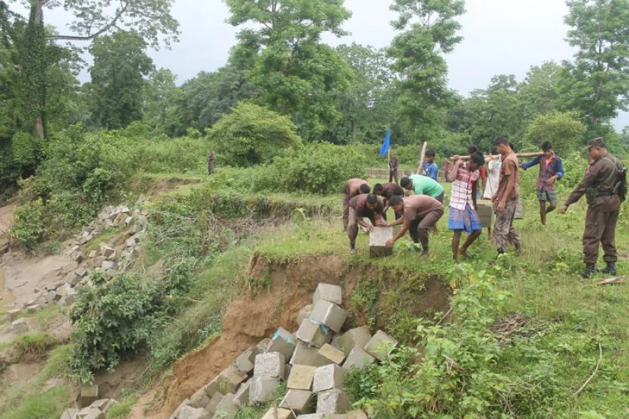 BGB jawans are helping the locals to dump concrete blocks to prevent the land from the river erosion of Feni