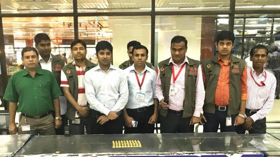 Customs Intelligence officials display the 40 gold bars which were hidden inside the vaginas of the women Collected