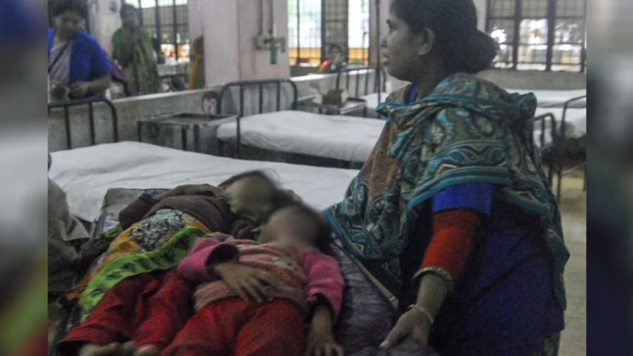 A mother on the bedside of her two ailing children, who have been suffering from a mysterious disease, at the Chittagong Medical College Hospital on Wednesday, July 12, 2017 Rabin Chowdhury/Dhaka Tribune