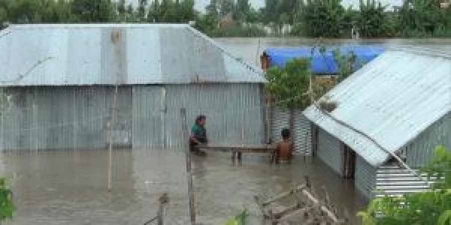 Marooned in floodwater, people trying to relocate their properties in Kurigram sadar upazila. The photo was taken on Tuesday DHAKA 