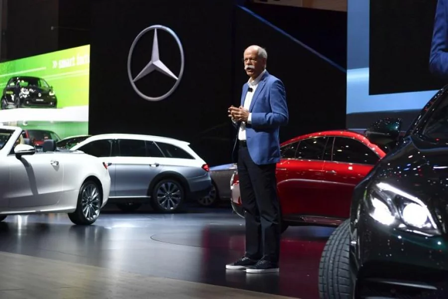 CEO of German carmaker Daimler and Mercedes-Benz, Dieter Zetsche,centre, stands next to Mercedes model cars during the first press day of the Geneva International Motor Show on March 7, 2017 in Geneva AFP