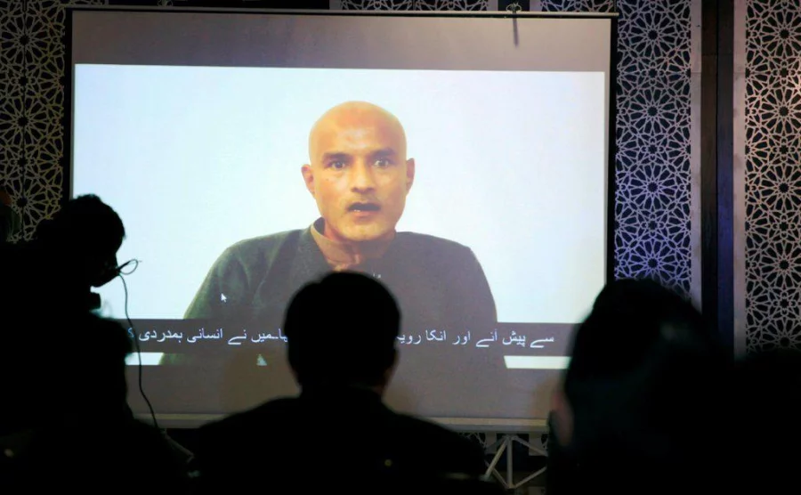 Former Indian navy officer Kulbhushan Sudhir Jadhav is seen on a screen during a news conference at the Ministry of Foreign Affairs in Islamabad, Pakistan December 25, 2017. REUTERS/Faisal Mahmood NO RESALES. NO ARCHIVES
